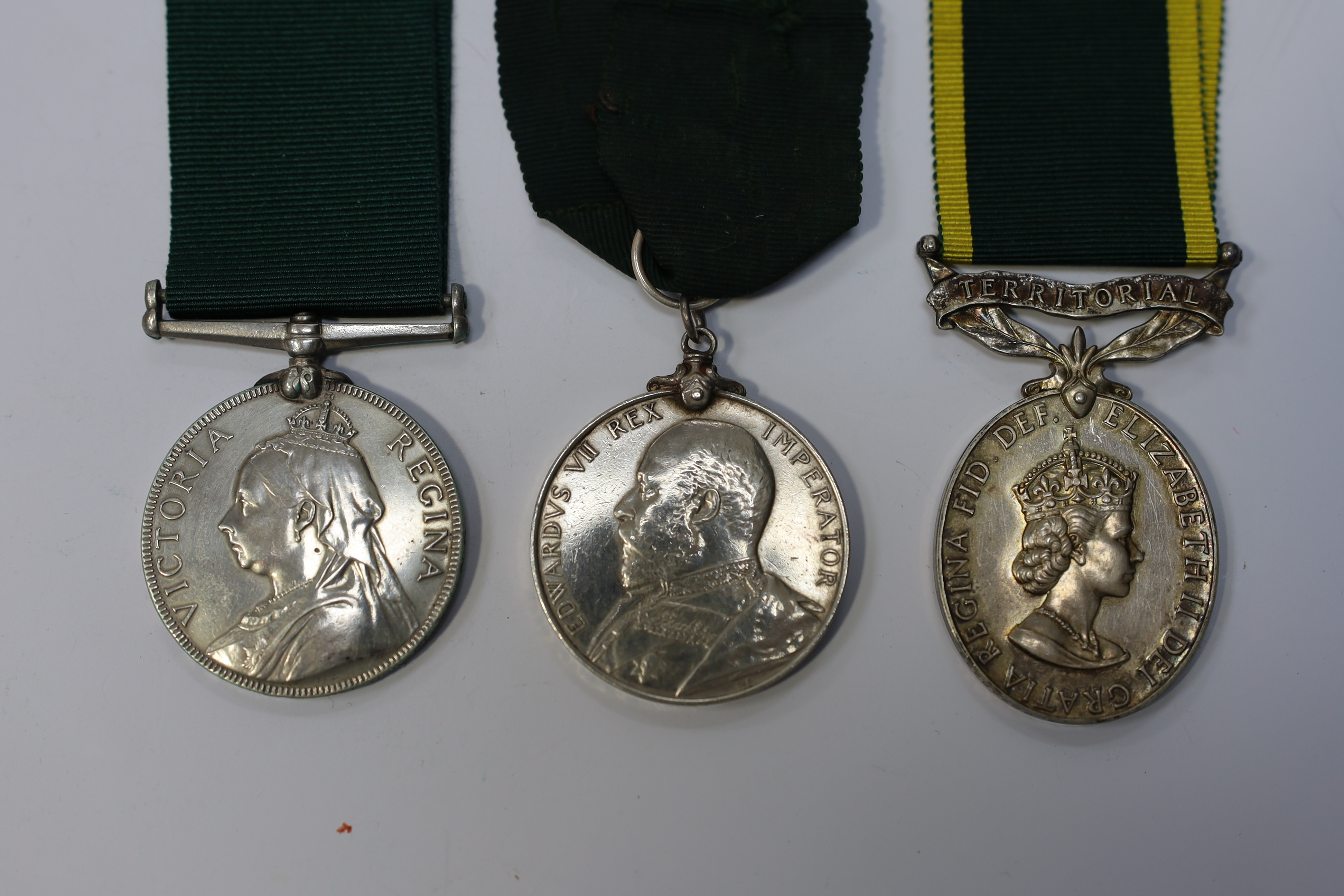 Three assorted service medals; Vict Volunteer Long Service to 186. Cpl. J.Camplin. 1st Dorset.Vol.Art: Ed VII Volunteer Long Service to 2731 Sjt:A.G.Wright. 4/V.B.Durham L.I.; ERII Territorial Efficiency Medal to 2228226